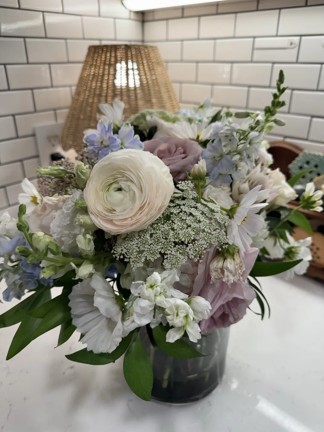 The bridal bouquet from another angle, with a white ranunculus and Queen Anne’s lace